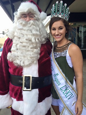Queen sugar with Santa Claus during New Iberia Christmas parade