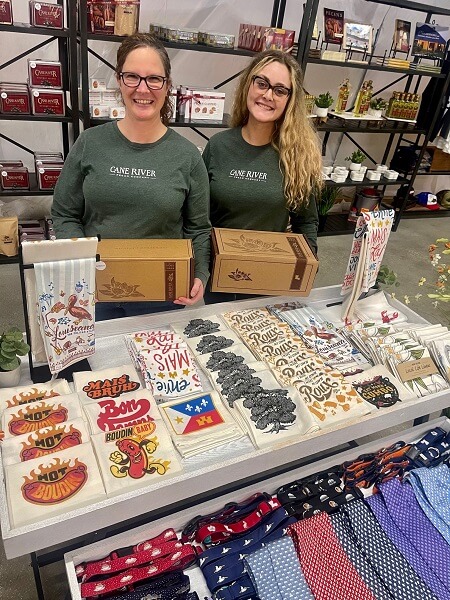 Cane River Pecan Company employees pose with an assortment of gifts at the New Iberia gift shop.