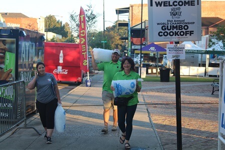 World Championship Gumbo Cookoff volunteers arrive at Bouligny Plaza in New Iberia.