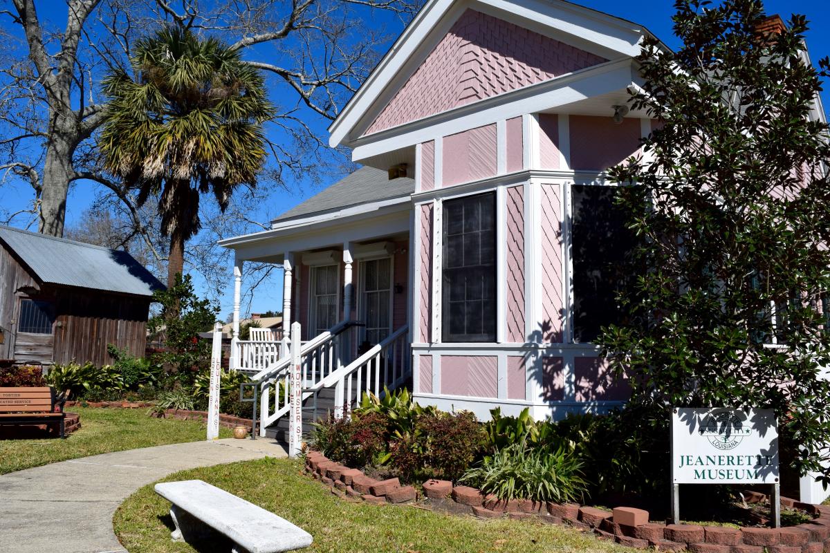 The Jeanerette Museum is an early 20th century Victorian home with a pink facade