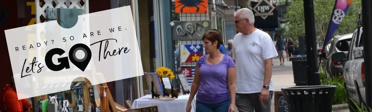 Couple looking at art booth in New Iberia Historic District