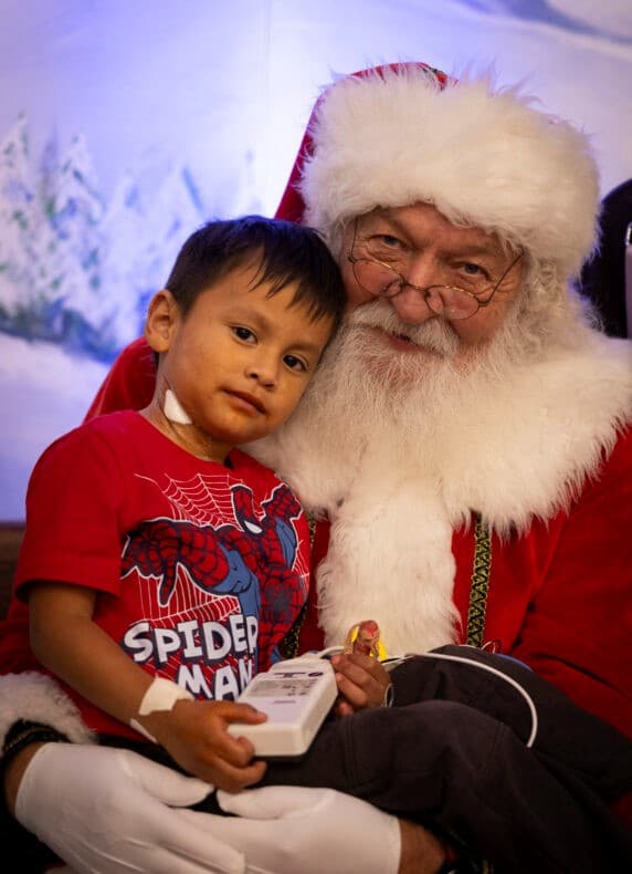 Child with Santa at Holiday Shopping on da Bayou