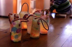 colored lanterns decorated with rope and lighted interior. example of lanterns for Shadows program
