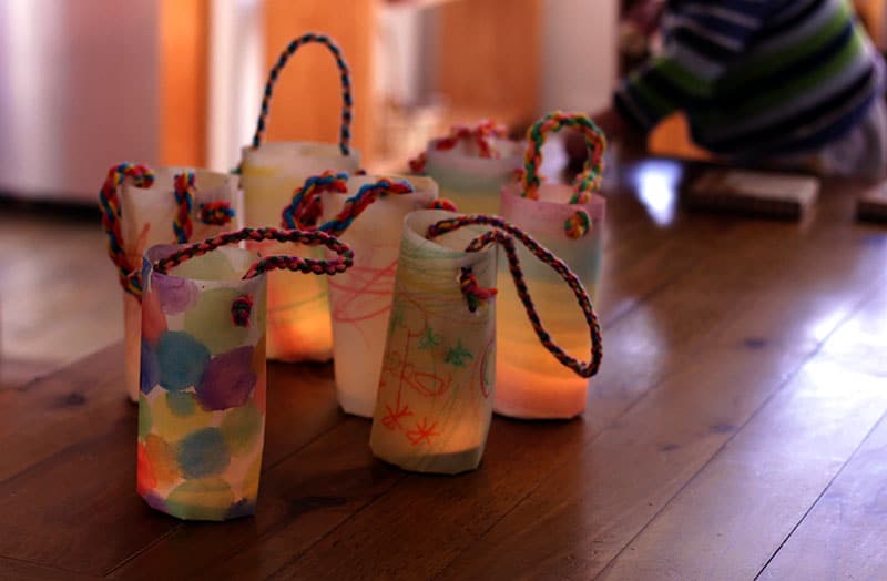 colored lanterns decorated with rope and lighted interior. example of lanterns for Shadows program